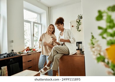 Two partners share laughter and drinks while preparing fresh breakfast. - Powered by Shutterstock