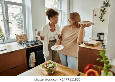 Two partners share a light-hearted moment while preparing breakfast. - Powered by Shutterstock