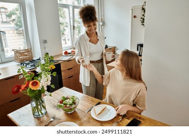 Two partners sharing a joyful moment over breakfast in their sunny kitchen. - Powered by Shutterstock