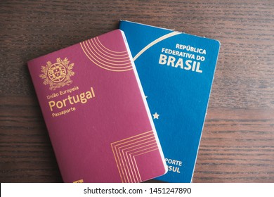 Two passports, portuguese and Brazilian, side by side.