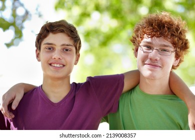 Two Peas In A Park. Portrait Of Two Teenage Boys Hanging Out At The Park.