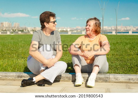 Similar – Image, Stock Photo Senior and young sportswoman looking away