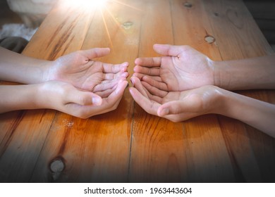 Two People Christian Praying Together On Wooden Table At Home, Christian Concept.