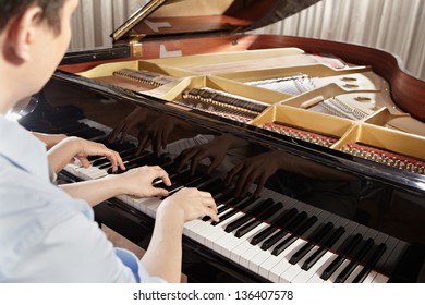 Two People, A Couple Playing Piano Duet, Showing Mostly Their Hands