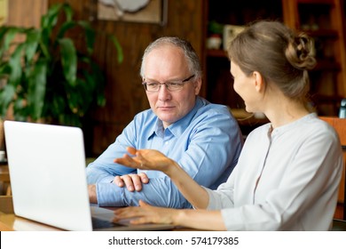 Two People Discussing Business Issues In Cafe