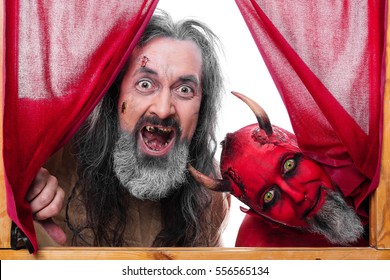 Two People Are Dressed For Carnival, Devil And Insane Man