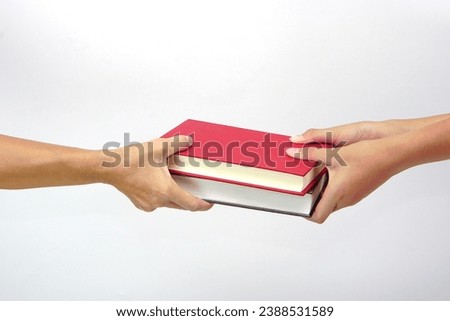 Two people exchanging books or sharing books on white background. exchanging knowledge and education concept.