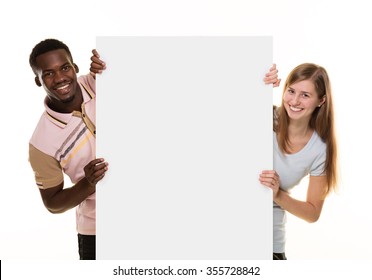 Two people holding a blank sign.