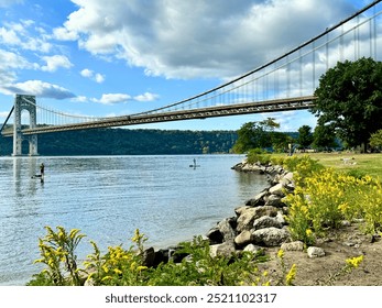 Two people paddleboarding in the Hudson River in front of the George Washington Bridge in New York City - Powered by Shutterstock