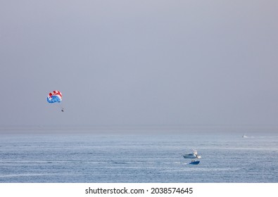 Two People Parasailing In Mission Beach, California.