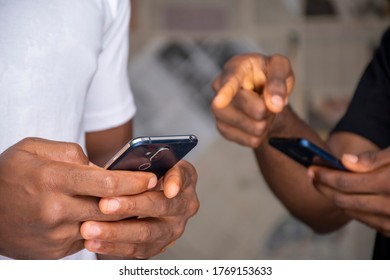 Two People Sharing Content Via Their Mobile Phones