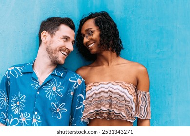 Two people are sharing a laugh and enjoying each other's company, showcasing the beauty of love and acceptance in a vibrant setting. Transgender woman - Powered by Shutterstock