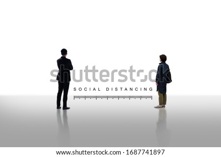 Two people standing keep distance with the word social distancing in between concept, New normal concept, People keeping distance for infection risk and disease Coronavirus.