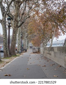 Two People Walking On Path In The Fall Season