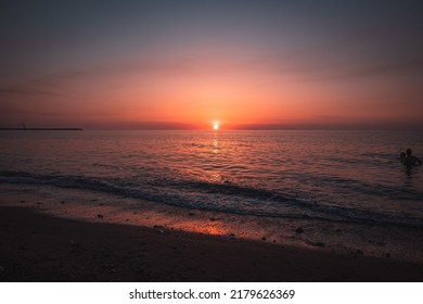 Two Peoples In Water Sea At The Sunset In My Favourite Place