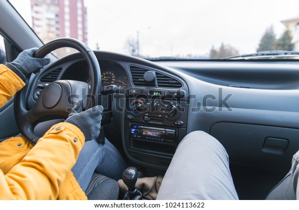 two person in\
car driving in cold winter\
day