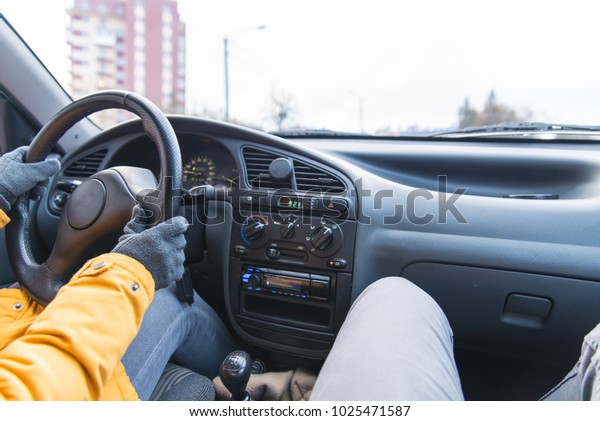 two person in\
car driving in cold winter\
day