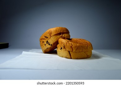 Two Pieces Of Bread On A Tissue