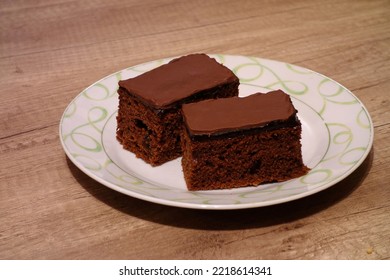 two pieces of gingerbread cake with  marmalade on plate - Shutterstock ID 2218614341