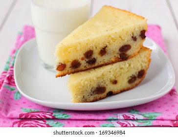 Two Pieces Of Semolina Cake With A Glass Of Milk