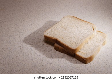 Two Pieces Of Toast Bread On Kitchen Desk. 