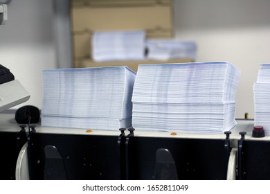 Two Piles Of White Paper Envelopes Ready For Printing