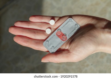 Two Pills For Emergency Contraception On The Hand Of A Woman.