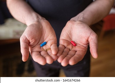 Two Pills In Hands, Red And Blue