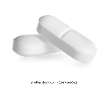 Two Pills On White Background