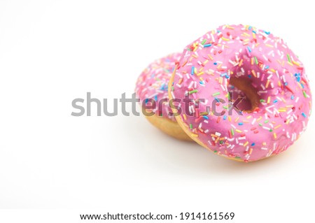 Two pink donuts on a white background