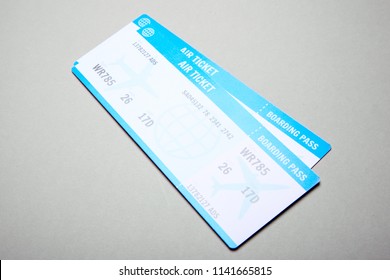 Two Plane Tickets On Gray Background. 