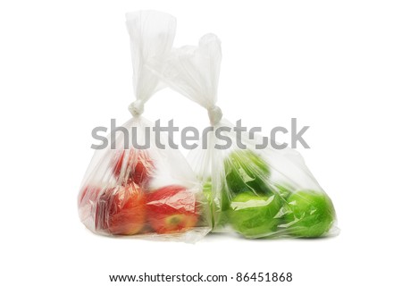 Two plastic bags of red and green apples on white background