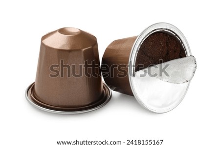 Two plastic coffee capsules isolated on white