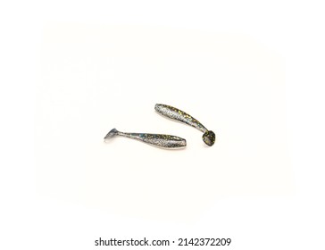 Two Plastic Worms Baits Paddle Tail Swim baits with Chartreuse Glitter isolated on white background. Shad fishing lure swim bait with clipping path and copy space.