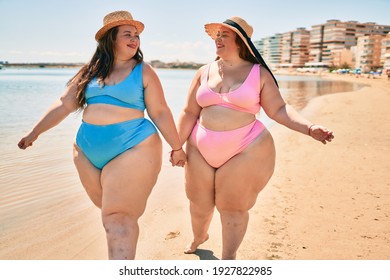 Two Plus Size Overweight Sisters Twins Women Happy And Proud Of Their Bodies Walking At The Beach On Summer Holidays