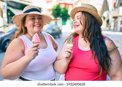 Two Plus Size Overweight Sisters Twins Women Smiling Eating An Ice Cream Outdoors