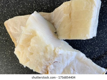 Two portions of cod fish ready for cooking after being rehydrated and desalted