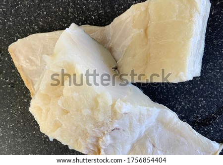 Two portions of cod fish ready for cooking after being rehydrated and desalted