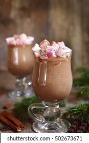 Two Portions Of Hot Chocolate With Mini Marshmellow In A Glasses On A Rustic Wooden Background.Space For Text.