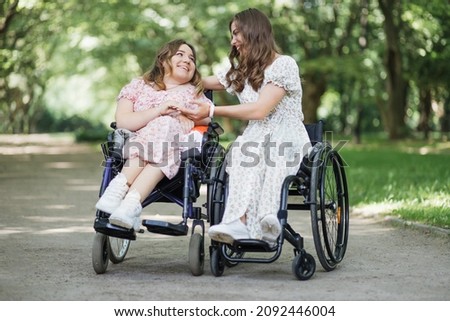 Similar – Daughter hugging senior mother in wheelchair