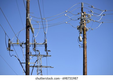 Two power poles in an electric power grid substation - Shutterstock ID 698731987