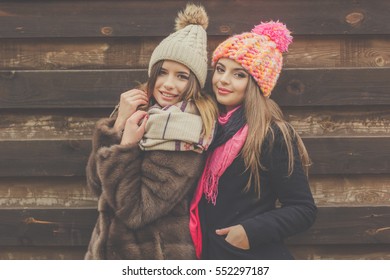 Two Pretty Girl Are Wearing Warm Winter Clothes