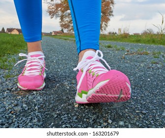 Two Pretty Legs In Pink Shoes Walking To Camera