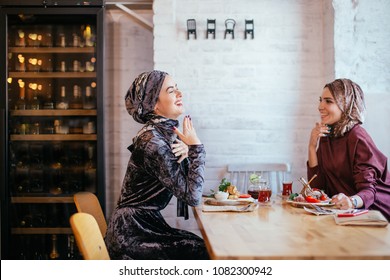 Two Pretty Muslim Women In Cafe, Friends Meeting