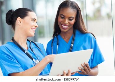 two pretty nurses using laptop computer 