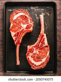 Two Prime Grade Tomahawk Ribeye Steaks - Shutterstock ID 2050745075