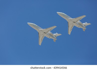 Two private jets flying side by side