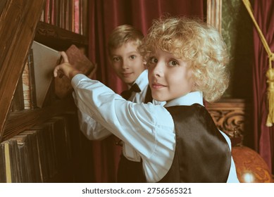 Two private school students choosing books in a classic library interior. British education style, curiosity, friendship and elite academic atmosphere.