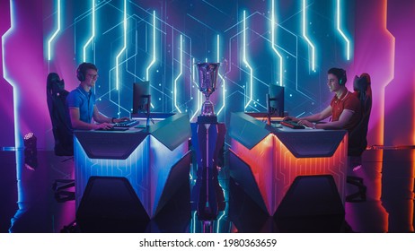 Two Professional Esport Gamers Competition in a Video Game on a Championship Arena, Both Playing Computer Games. Global Online Streaming Cyber Games Tournament - Shutterstock ID 1980363659