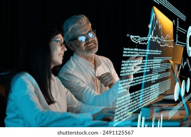 Two Professionals Analyze Data On Transparent Screens, Focusing On Charts And Graphs, Highlighting Technology And Collaboration In A Modern, Innovative Office Setting.